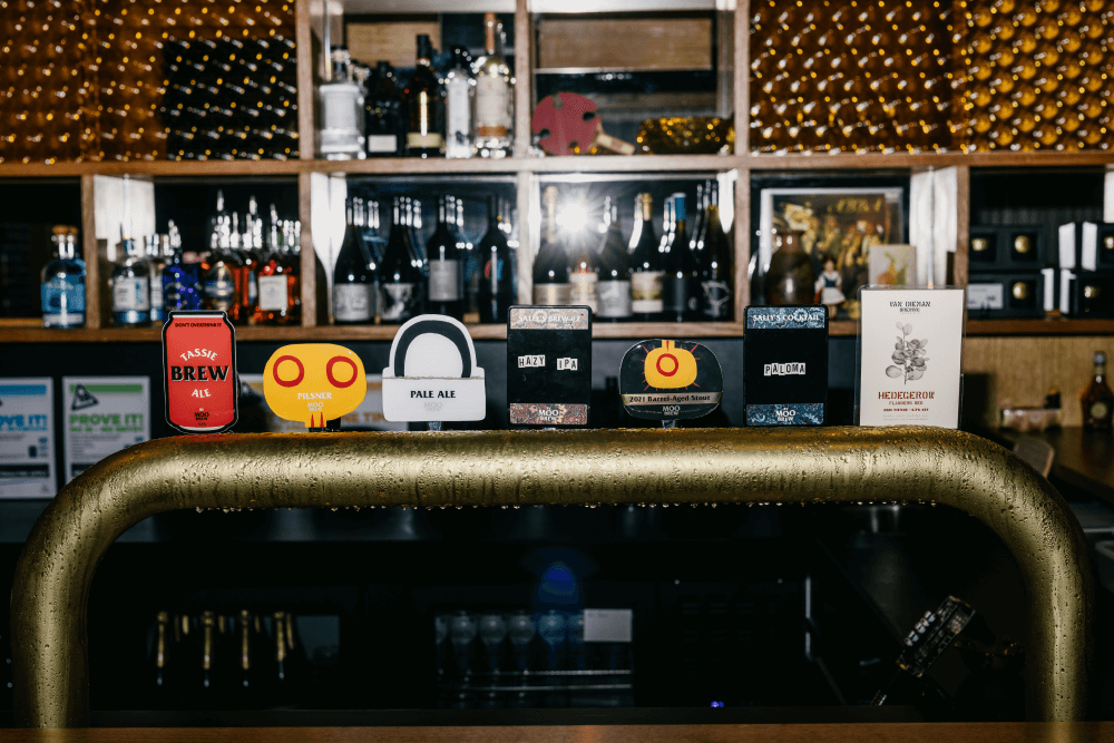 A bar with 6 beers on tap