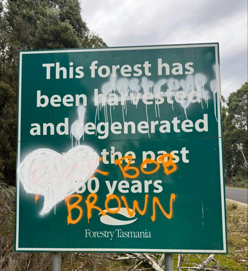 A graffitied Forestry Tasmania sign.