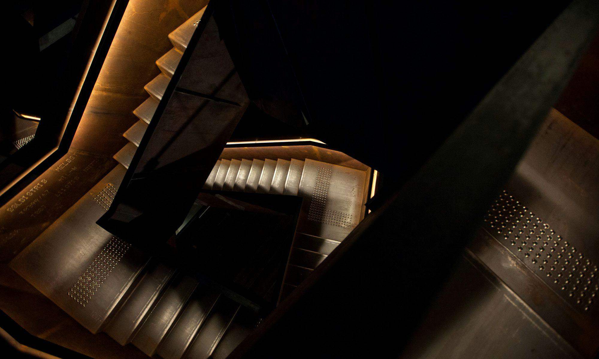 A dimly lit maze of staircases
