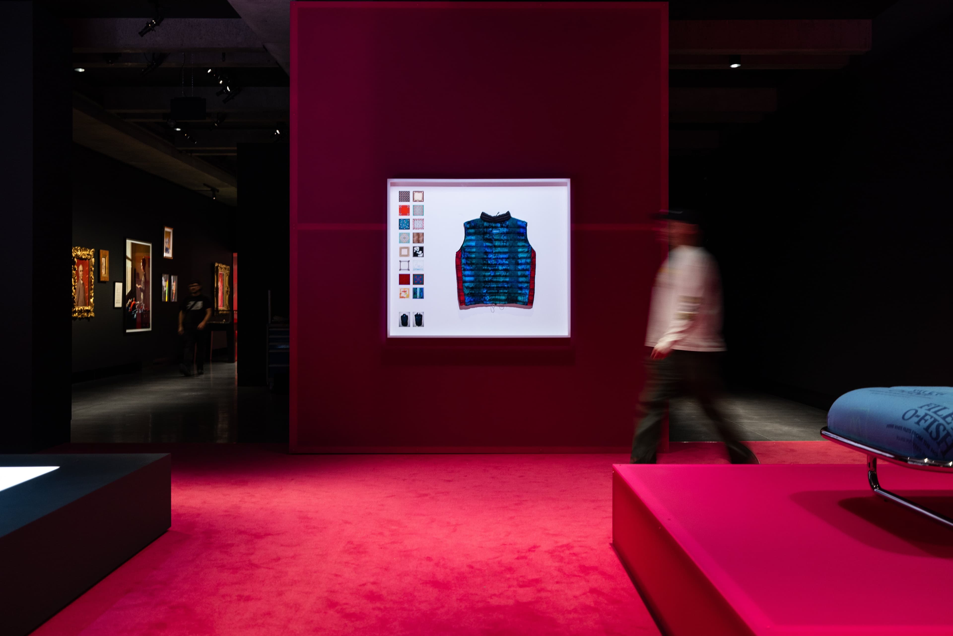 Namedropping gallery with pink carpet, showing Power Vest 6, 2020, Simon Denny