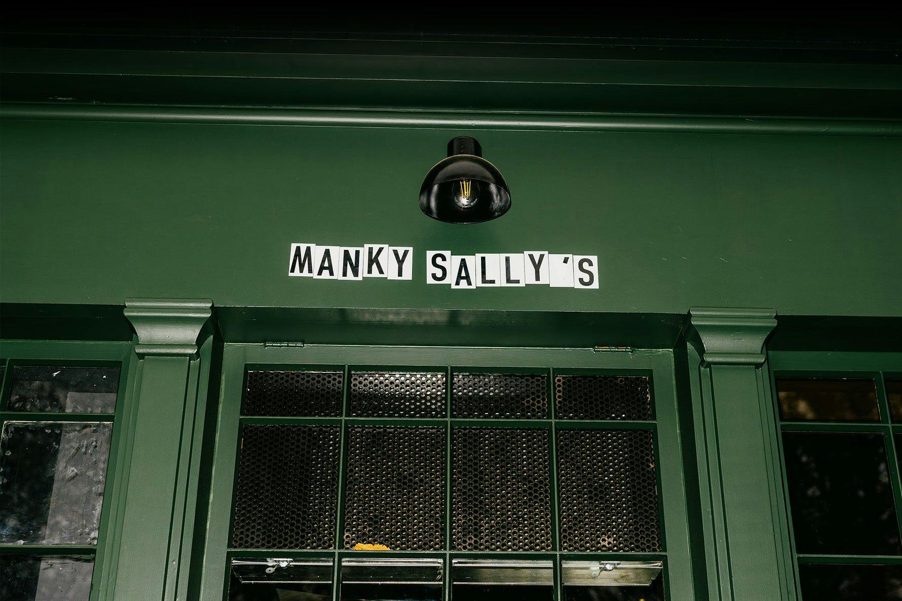 Green entryway of Manky Sally's