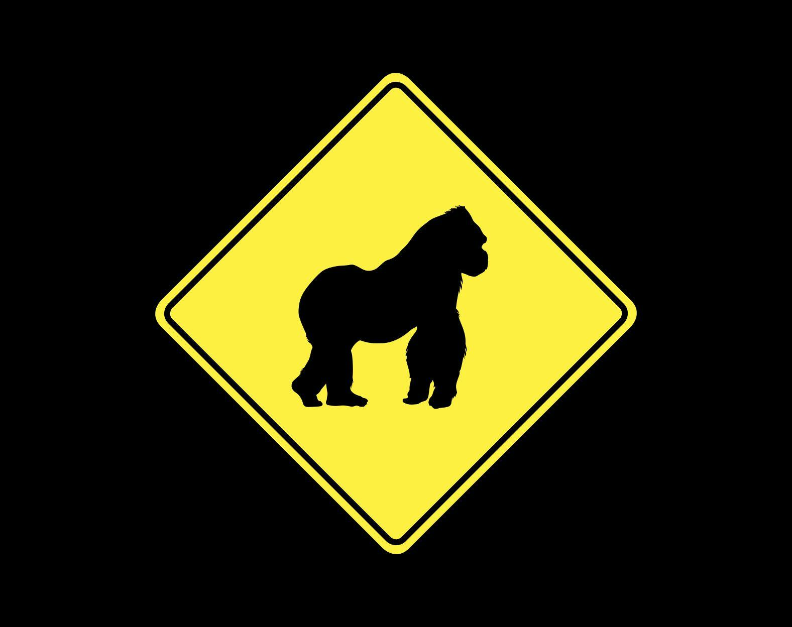 Yellow warning traffic sign with silhouette of a Gorilla