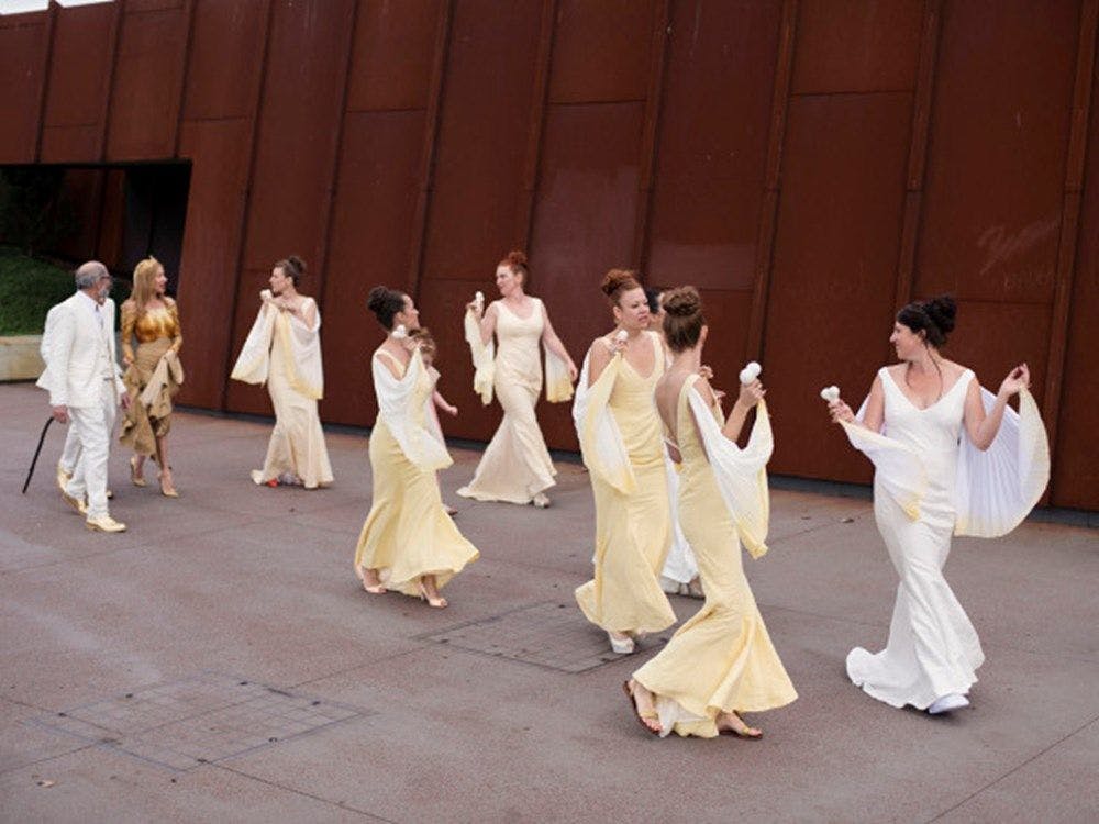 Bridal party of seven escorting Kirsha (bride) to the ceremony.  Dresses all of a golden/yellow colour with shawls.