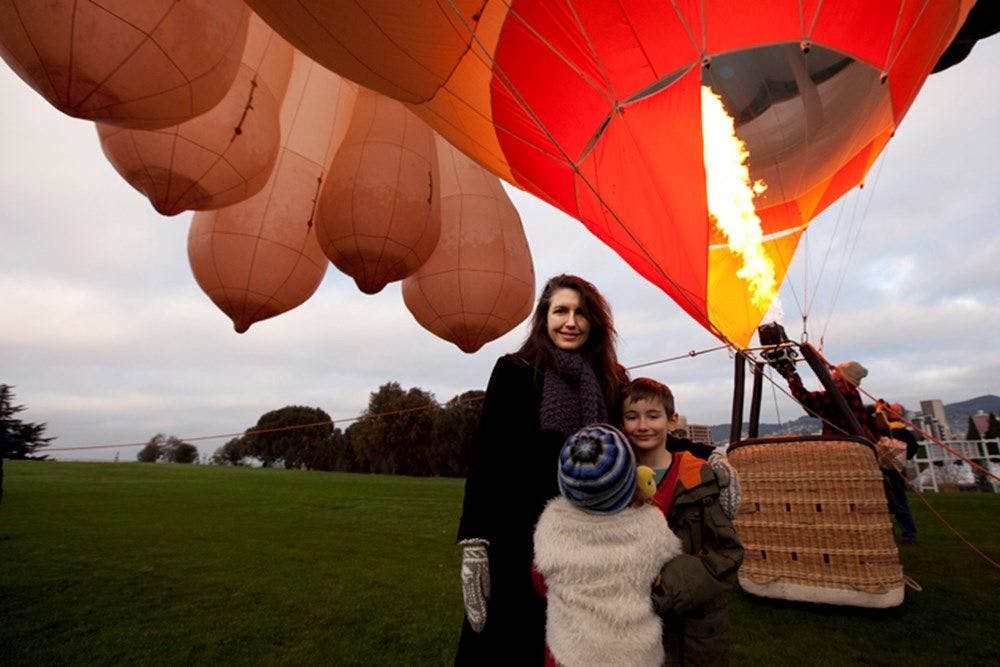 Patricia stands under the inflated teats of Skywhale