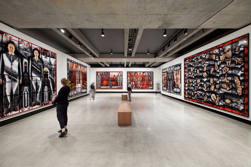 A gallery space filled with the works of Gilbert & George