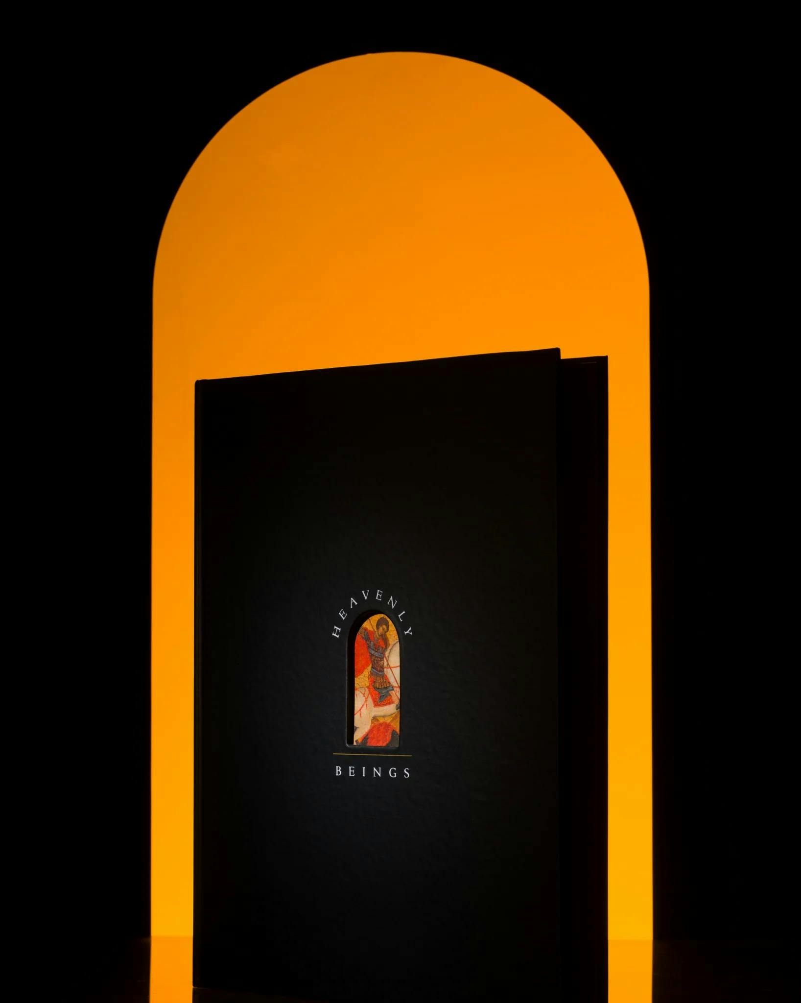 Heavenly Beings book cover on an orange and black background