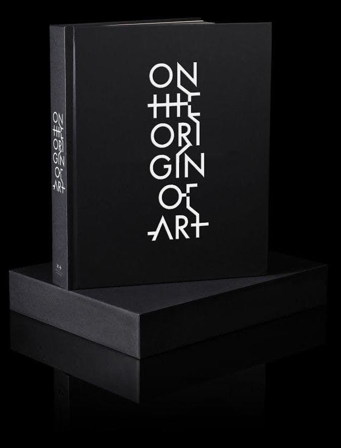 On the Origin of Art exhibition catalogue. Title in white text on a black background