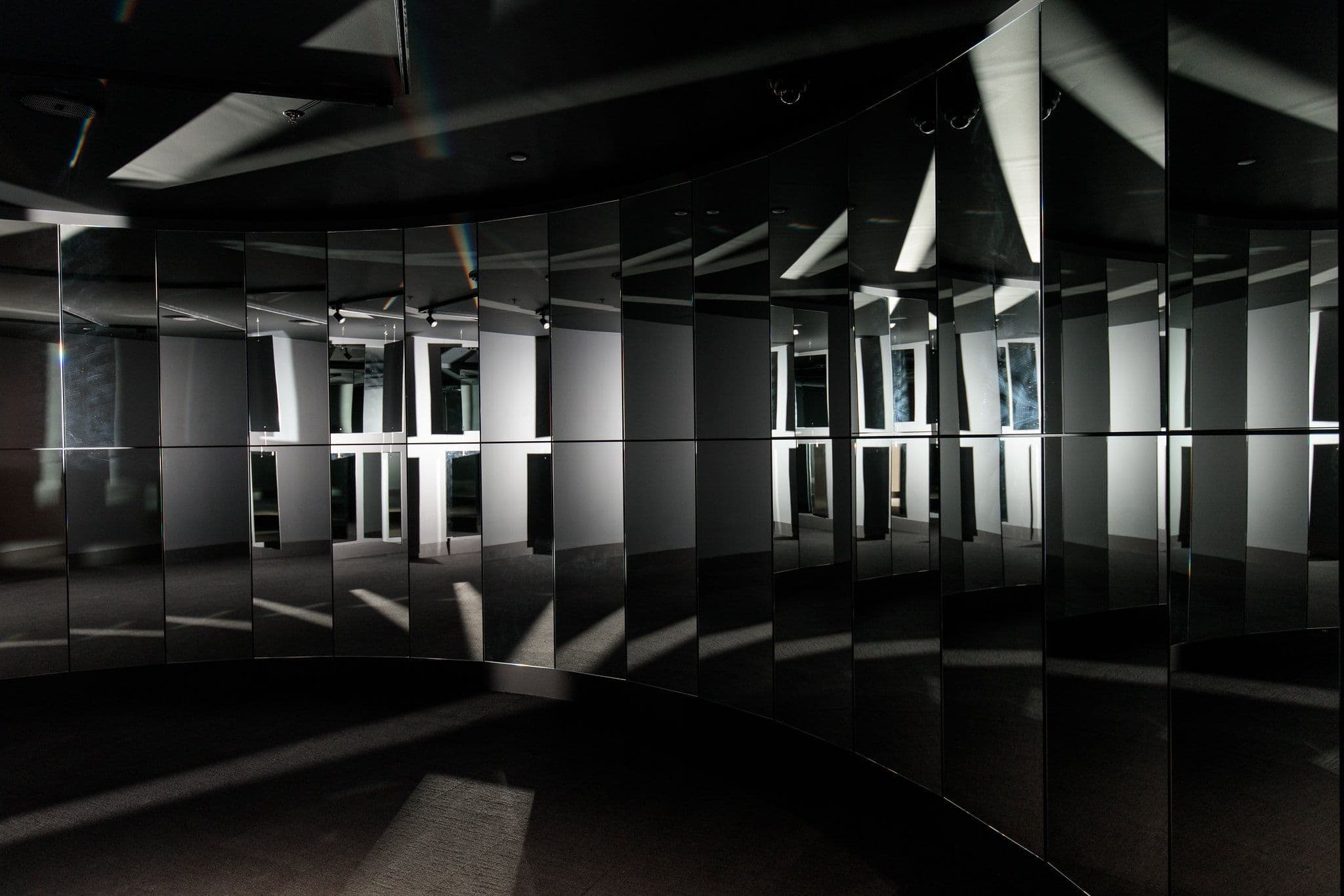 A dark room filled with mirrors and light